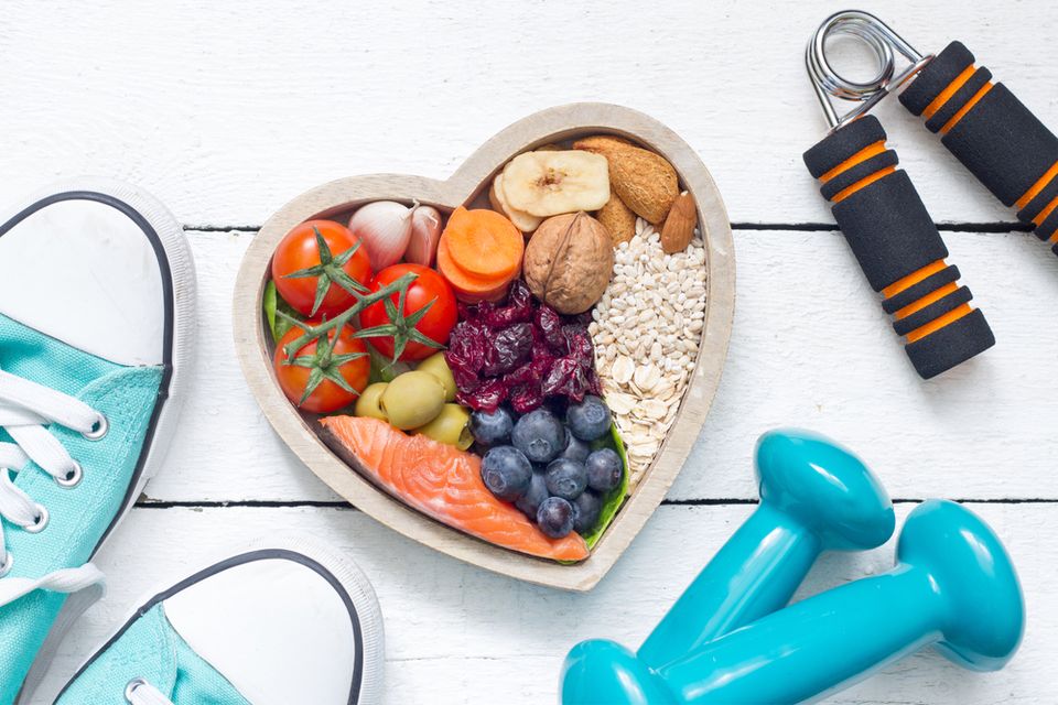 Heart shaped bowl with various healthy foods